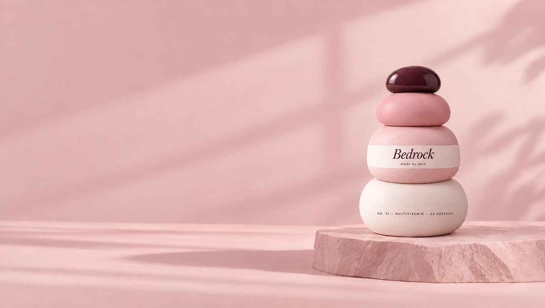 Bedrock cairn bottle on a stone plinth in soft light