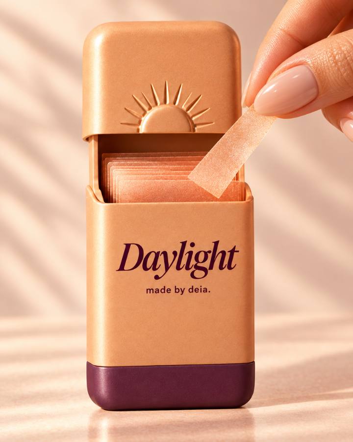 A finger lifting a Daylight energy strip out of its case